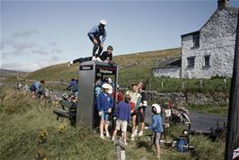 Lukas Wooller on the telephone box opposite Peases Cottage, Langdon Common, sampling the wind [Remastered scan, June 2019]