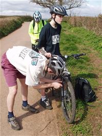 Brake adjustments by engineer Olly at Bramble Oak Cross near Denbury