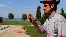Tao admires a large swimming pool by Lake Geneva at Quai du Vent-Blanc, 1.7 miles from the hostel
