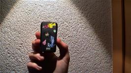 Joe shows us the stickers he has just attached to his Nokia phone - he bought them from a "girl's vending machine" for half a franc