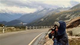 Joe zips up like an Eskimo to keep the cold out on the the long descent from the San Bernardino Pass at La Smita