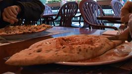 Finally our excellent Italian-style pizzas arrive at Borelli's pizza restaurant, Airolo