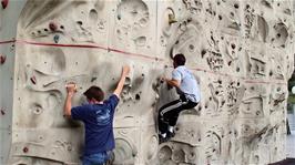Joe and Tao try their hand on the climbing wall