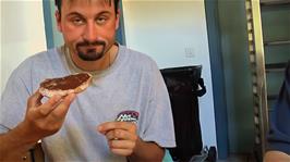 Tao enjoys Nutella on wholemeal bread for breakfast at Sion hostel