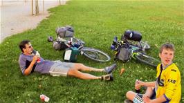 Tao and Joe take a rest at Place d'Armes, Cully, 58.4 miles into the ride