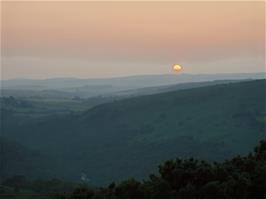 The sun sets beyond Two Bridges as the Dart Valley becomes shrouded in darkness - new photo for 2025