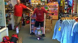Sam masters the Onewheel Skateboard in the Cotswold outdoor shop at Grasmere