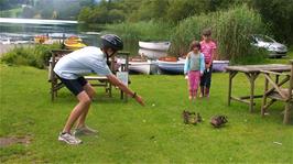 Freddie feeds the ducks while we wait to board our rowing boats at Faeryland, Grasmere