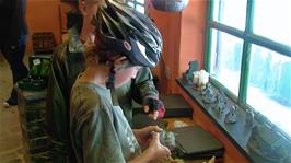 Henry and Sam check out the Slate merchandise on sale at the Honister Slate Mine