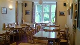 The dining room at Buttermere Youth Hostel, with water dripping down from the burst pipe above