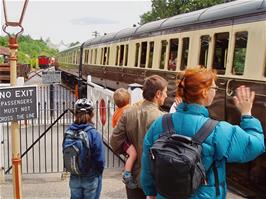 The train passes through the level crossing at Staverton on its way to Totnes - new photo for 2025