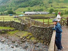 Crossing the footbridge over the River Derwent on our way up to Sourmilk Gill waterfall, 2.3 miles from Borrowdale YH