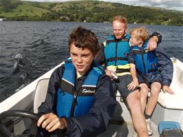 Freddie takes the controls of our hire boat on Lake Windermere