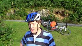 Michael advances to retrieve his camcorder from Lawrence, who seems unable to hold it steady while filming