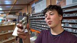 Lawrence is disappointed to see that this little rabbit, for sale in the Slate Mine gift shop, was made in China