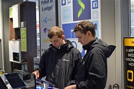 Dillan and Jude check out Norwegian mobiles in the Elkjøp Phonehouse in Strandgaten, Bergen