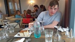 Dillan and Michael prepare for soup and a burger at the West Highland Hotel, Mallaig.  The family behind Dillan are indeed eating a huge seafood platter